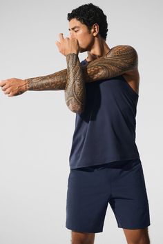 No matter the workout, the Conquer Muscle Tank is equipped for the challenge. It’s made with soft, breathable Conquer performance fabric that keeps up with every move. With a crew neck, wide arm holes and a straight, finished hem, it wears well with the matching short and a chill hoodie for gym days and rest days. Airy, performance engineered Conquer tank Ultra-soft & breathable for working out & wearing out Designed & uniquely fit for every size Wear-tested by our in-house team for the perfect Sports Activewear With Thumbholes And 4-way Stretch, 4-way Stretch Activewear With Thumbholes For Sports, Functional Activewear With Thumbholes And 4-way Stretch, Activewear With Thumbholes For Training, Sporty Alo Yoga Activewear For Training, Alo Yoga Athleisure Activewear For Sports, Alo Yoga Moisture-wicking Activewear For Training, Alo Yoga Activewear With Go-dry And 4-way Stretch, Functional Alo Yoga Activewear With 4-way Stretch