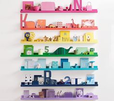 colorful shelves are stacked on top of each other in the shape of letters and numbers