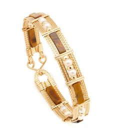 Beautiful wrapped wire bangle of 14k gold-filled wire with Tiger Eye Gemstone beads. Select from 4 different styles Approximately 1/2 inch wide. Tiger1 - Long Square Tube with Gold beads (BR_TigLSTGB_01) $119 Tiger2 - Long Square Tube w/Single Pearl & Gold beads (BR_TigLST1PGB_02) $129 Tiger3 - Long Square Tube with Pearls & Gold beads (BR_TigLSTPGB_03) $129 Tiger4 - Barrel with Pearls & Gold Beads (BR_TigBPGB_04) $129 Compass Jewelry, Wire Bangles, Wire Wrapped Bracelet, Tigers Eye Gemstone, Jewelry Outfit, Gold Wire, Simple Jewelry, Jewelry Inspo, Dream Jewelry