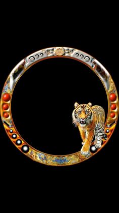 a tiger is walking in the middle of a circular frame with beads on it's sides