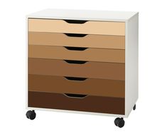 a white and brown dresser with four drawers