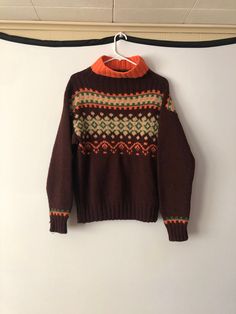 "Handknit vintage brown fair isle sweater. Design on the front only. Mock neck.  Measurements are taken lying flat: sleeve: 22\" chest: 42\" length: 24\" 066" Vintage Fairisle Sweater, Fair Isle Pullover, Motif Fair Isle, Reversible Coat, Cute Coats, Fair Isle Sweater, Green Coat, Mock Neck Sweater, Vintage Brown