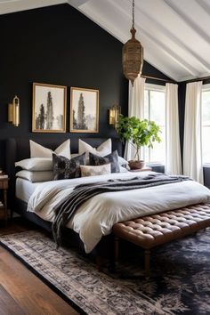 a bedroom with black walls and white bedding