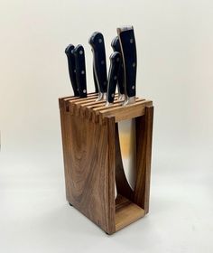 a wooden block with knives in it