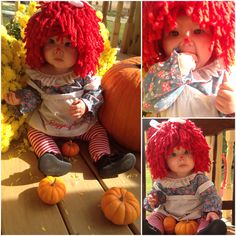 a doll with red hair sitting on top of a wooden table next to pumpkins