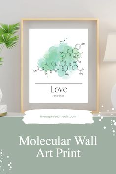 a poster with the words love on it next to a lamp and potted plant