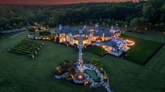 an aerial view of a mansion at night