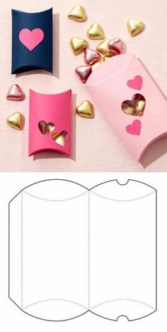 an open book with hearts cut out of it and some gold foil on the pages