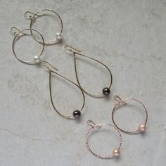 "White Freshwater Pearl Earrings~ These elegant sterling silver hoop earrings with a freshwater white pearl will look great for any occasion. Hammered and polished to a beautiful shine. Choose hoop size 1\" or 1.5\" Also available in 14k gold fill~ https://www.etsy.com/listing/199753367/white-pearl-hoop-earrings-small-gold?ref=shop_home_active_4 Also available with peacock pearls~ https://www.etsy.com/listing/269037112/peacock-pearl-earrings-freshwater-pearls?ref=listing-shop-header-0 Shop~bhttp Elegant Wire Wrapped Hoop Earrings For Anniversary, Silver Teardrop Hoop Earrings With Pearl Charm, Silver Hoop Jewelry With Pearl Drop, Silver Teardrop Pearl Hoop Earrings, Silver Small Hoop Pearl Earrings For Anniversary, Silver Small Hoop Pearl Earrings For Wedding, Silver Pearl Hoop Jewelry, Sterling Silver Hoop Earrings With Pearl Drop For Anniversary, Surfer Girl Gifts