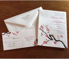 wedding stationery with cherry blossoms on white paper