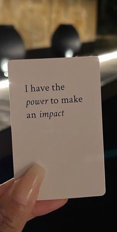 someone holding up a piece of paper that says i have the power to make an impact