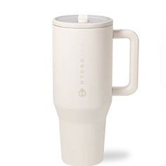 a white coffee cup with a lid and handle on the side, sitting in front of a white background