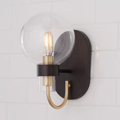 a wall light with a glass ball on it