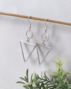 Ethnic Long Geometric earrings 🌿 This pair is made of hypoallergenic brass parts. No Nickel and no Lead. . Light to wear and easy to combine. 🌿 . The item will arrive to you wrapped as a gift in a paper gift bag. . 》SHIPPING: If you need a tracking number for your order change the shipping option before checkout. 🌎 . If you have any questions please contact me, I usually respond quite fast 💌 . 》Please before ordering read my shop's announcement and check carefully the estimated delivery time Minimalist Handmade Triangle Earrings, Earth Element Symbol, Minimalist Triangle Nickel-free Earrings, Elegant Triangle Metal Earrings, Silver Triangle Single Earring, Lead Light, Nickel-free Metal Triangle Earrings, Earth Element, Element Symbols