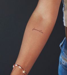 a woman's arm with a tattoo that reads, janelle on the wrist