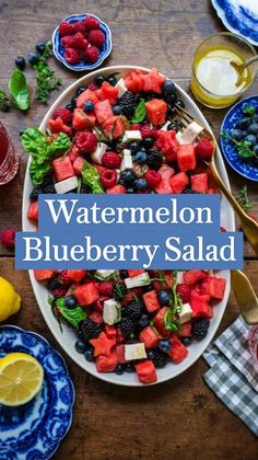 watermelon blueberry salad on a plate with lemons, raspberries and mint