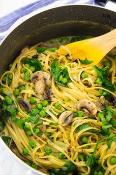 pasta with peas and mushrooms in a skillet