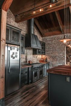 a kitchen with brick walls and wooden floors