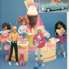 an advertisement for barbie toys with dolls in front of a cake and ice cream parlor