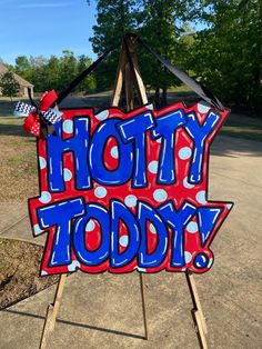 a sign that says, hotty today on the side of a wooden easel