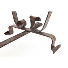 an old metal table with two legs and one leg bent down to the side, on a white background