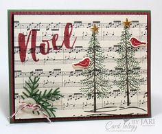 a handmade christmas card with musical notes and trees