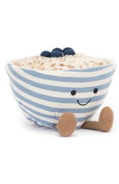 a blue and white striped bowl filled with oatmeal