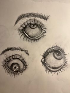 three different types of eyes drawn in pencil