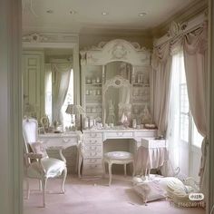 a bedroom with white furniture and pink carpeted flooring in front of a large mirror