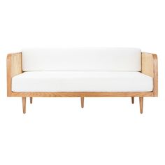 a white couch sitting on top of a wooden frame