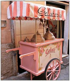 an old fashioned ice cream cart on the street