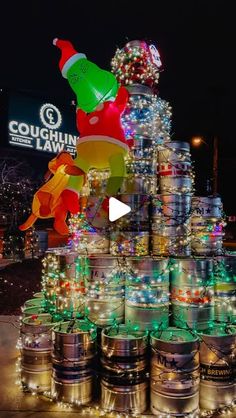 a large christmas tree made out of kegs