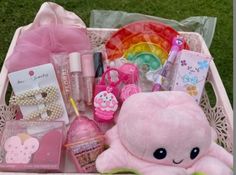 a pink basket filled with lots of items