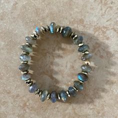 This exquisite labradorite bracelet set is the perfect way to showcase your unique style. The set features fiery labradorite stones that capture the light and emit an intense, multicolored glow that will add an elegant touch to any look. It's very comfortable to wear and can be wonderfully dressed up or down. Labradorite is, in every sense, a Stone of Magic, a crystal of shamans, diviners, healers, and all who travel and embrace the universe seeking knowledge and guidance. For self-discovery, it Adjustable Labradorite Gemstone Beads Bracelets, Labradorite Bracelets With Natural Stones For Healing, Adjustable Labradorite Spiritual Crystal Bracelet, Round Spiritual Labradorite Bracelet, Labradorite Bracelets With Natural Stones, Multicolor Labradorite Jewelry With Natural Stones, Iridescent Labradorite Jewelry With Natural Stones, Multicolor Labradorite Natural Stones Jewelry, Labradorite Bracelets With Round Natural Stones