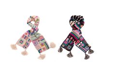 two scarves with tassels on them are shown in different colors and patterns