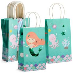 three bags with mermaids on them sitting next to each other