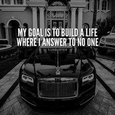 a black car parked in front of a house with the words, my goal is to build a life where i answer to no one