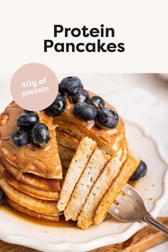 a stack of pancakes with blueberries on top and the words protein pancakes above it