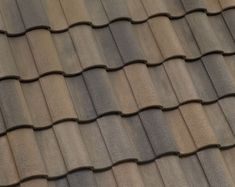 an image of a roof that is made out of metal shingles and concrete tiles