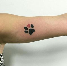 a person with a paw tattoo on their arm