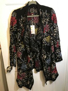 Johnny Was Biya Pua Black Cotton Floral Embroidered Wrap Cardigan S Boho Chic. Condition is New with tags. Shipped with USPS Priority Mail. About 18.5” pit to pit 31” long From smoke free home $450 I would encourage you to Google this and look at stock photos for more info Embroidered Open Front Cardigan, Fitted Long Sleeve Cardigan With Floral Embroidery, Fitted Bohemian Cardigan With Floral Embroidery, Black Embroidered Long Sleeve Cardigan, Fall Floral Print Open Front Cardigan, Black Embroidered Cardigan For Fall, V-neck Floral Embroidery Cardigan For Fall, Embroidered Black Cardigan For Fall, Black Cardigan With Floral Embroidery