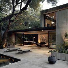 a modern house with an outdoor patio and pool