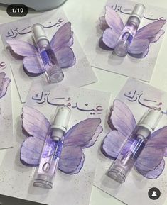 four purple butterflies on top of each other with the words, i love you in arabic