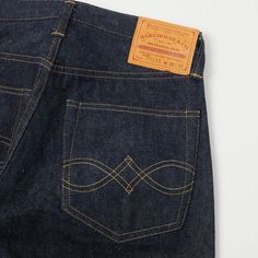 The best selling 1947 model has been brought back to life by Warehouse & Co, and this time, it’s in a crisp raw denim option. This mid-rise, straight leg jean is a champion of the post war denim period, and displays extravagant detailing as the world recovered from the Second World War. Cross arches have been sewn into the back pockets, while concealed copper rivets help to reinforce the back pockets. Punch through copper rivets can be found throughout, while a branded leather patch adorns the w Denim Back Pocket Design, Workwear Boots, Model Jeans, Denim Repair, Moc Toe Boots, Ivy Style, Mountaineering Boots, Wing Shoes, Red Wing Shoes