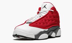 The Air Jordan 13 is the preschool sizing of the popular "Red Flint" version, which looks identical to the "Red Flint" high-top for adults.  This iteration is arranged in an identical color block to that model with a head-turning Gym Red hue.  The rest of the shoe is made with white tumbled leather on the toe and perforated leather on the tongue with a holographic emblem on the collar and grey suede on the mudguard.  A black Jumpman logo is embroidered on the tongue and “Jordan” text appears on Red Jordans, Jordan 13 Shoes, Jumpman Logo, Stadium Goods, Jordan 13, Kids Jordans, Grey Suede, Perforated Leather, Gray Suede