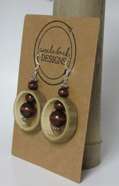 Bamboo earrings made from salvaged bamboo.  This pair includes wood and silver colored beads and silver hardware. The bamboo is sealed with Mod Podge and finished with clear, acrylic spray. Coconut Jewelry, Bamboo Jewelry, Resin And Wood Diy, Wood Jewelery, Bamboo Earrings, Bone Jewelry, Earrings Large, Wooden Pendant, Wire Crafts