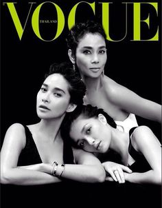 three women are posing on the cover of a magazine, with their arms around each other