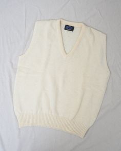 [the gentle hum of rain tapping on your windowpane]Vintage cream oversized wool sweater vest. Perfect for layering and staying cozy.•Sleeveless•V-neck•Oversized fit•Gorgeous woolLABEL: Jantzen - Made in USACONDITION: Vintage / ExcellentSIZE: Fits Oversized S/M or L more fittedErika is 5'10" and a size S in tops + M/L in bottoms. Please make sure to double check your measurements with the ones listed in the tab below. Oversized Wool Sweater, Patchwork Top, Daily Bag, Vintage Tapestry, Velvet Bow, Chunky Knits Sweater, Party Looks, Powder Blue, Wool Sweater