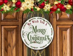 a merry christmas sign hanging from the side of a wooden door with holly and poinsettis