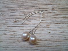 These very pretty earrings is perfect all year around and will make a beautiful addition to any jewellery collection. They are made with a simple ivory coloured fresh water pearls on a sterling silver hook. These earring can also be hung on a longer silver hook, please specify your preference at checkout. All of my jewellery is nickel free and handmade in my studio at Bradborne House in East Malling, Kent. Elegant Wedding Threader Earrings, Classic Threader Drop Earrings For Wedding, Single Long Drop Threader Earring For Wedding, Classic Wedding Threader Drop Earrings, Wedding Long Drop Threader Earrings, Classic Dangle Threader Earrings For Wedding, Wedding Pearl Drop Dangle Threader Earrings, Sterling Silver Threader Earrings For Wedding, Sterling Silver Wedding Threader Earrings